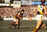 Mike Fitzpatrick of the Carlton Blues is tackled during a VFL match between Carlton Blues and Richmond Tigers